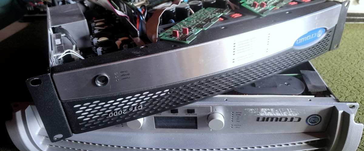 Real user photograph of amplifier front panels and rack units